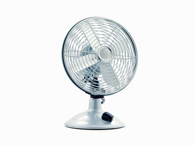 a silver fan against a white backdrop