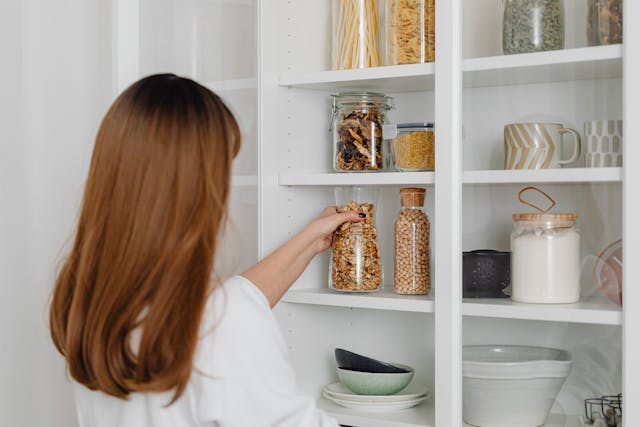 person looking at their pantry